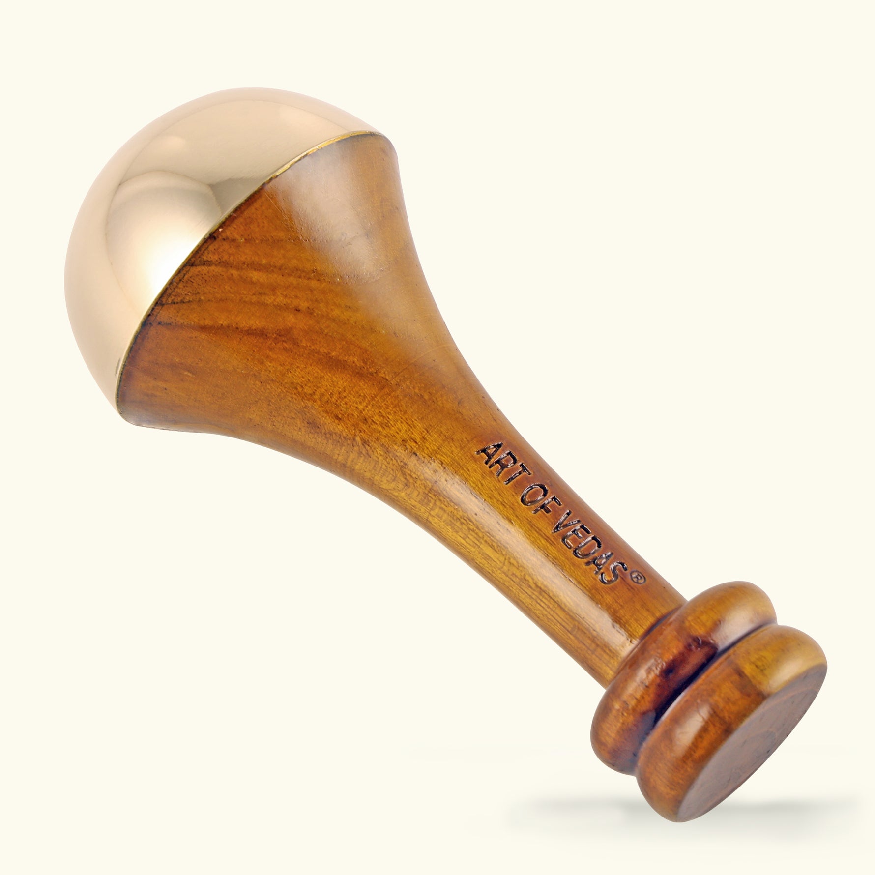 A close-up image of the Art of Vedas Body Massage Kansa Wand, showcasing its large, smoothly polished metal dome and elegantly carved wooden handle. The tool is positioned against a serene, neutral background to highlight its sleek design and therapeutic purpose.